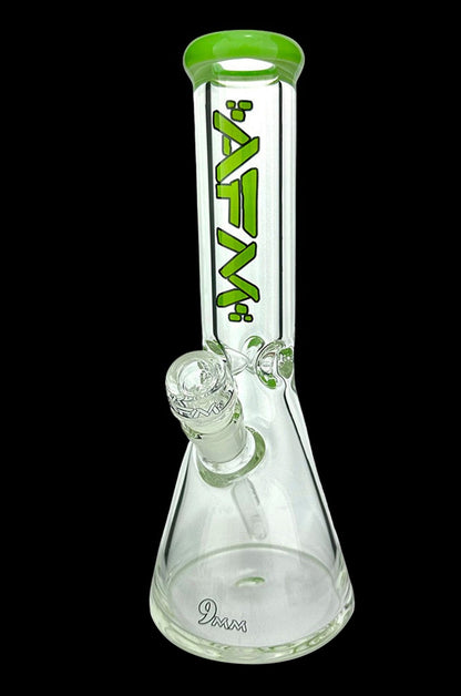 Clear glass beaker bong with green accents and a glass bowl.