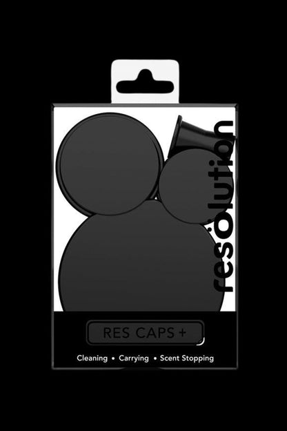 Black silicone caps packaged for cleaning, carrying, and odor control of cannabis concentrates.