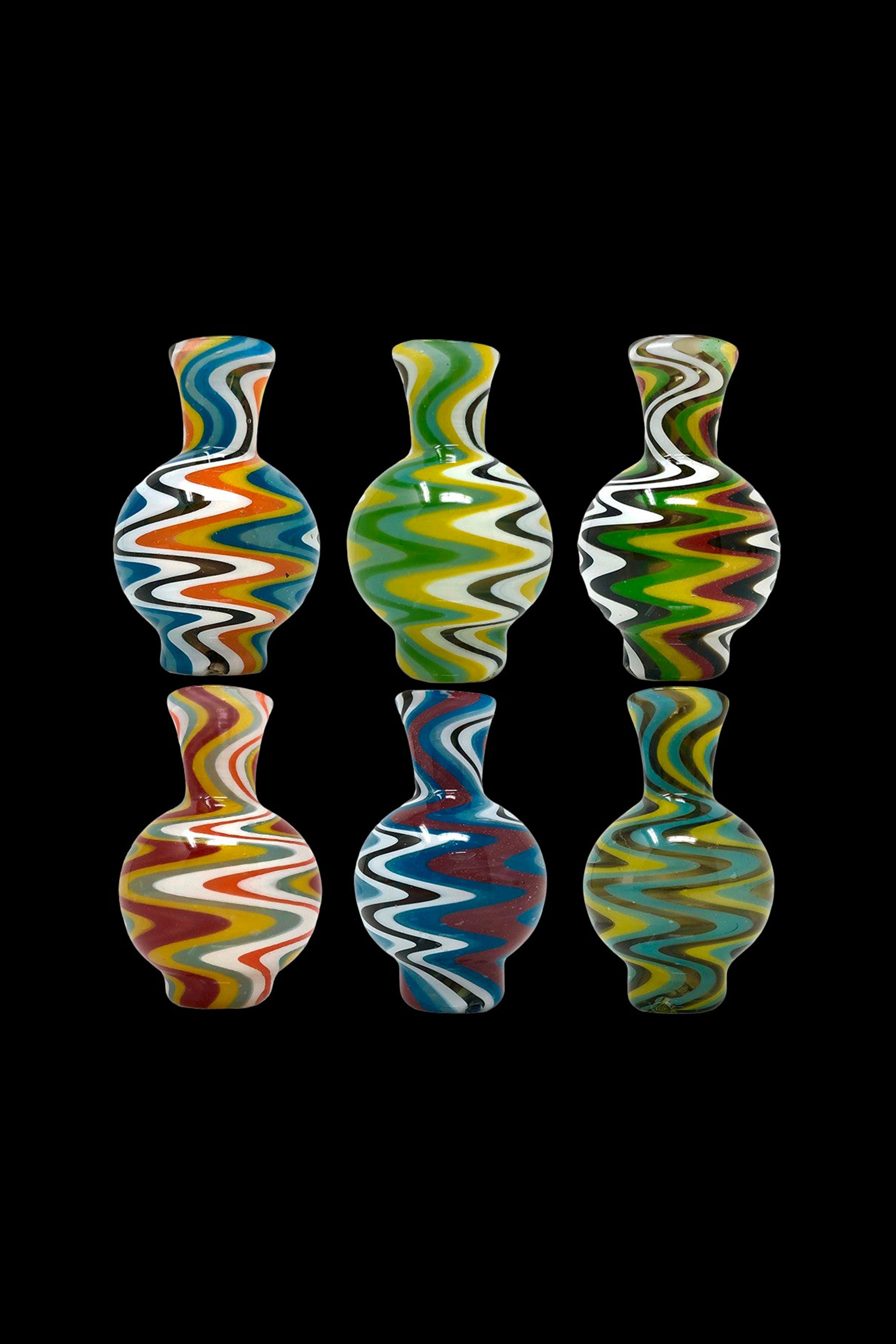 Three colorful glass bubblers with psychedelic swirl patterns against a black background.