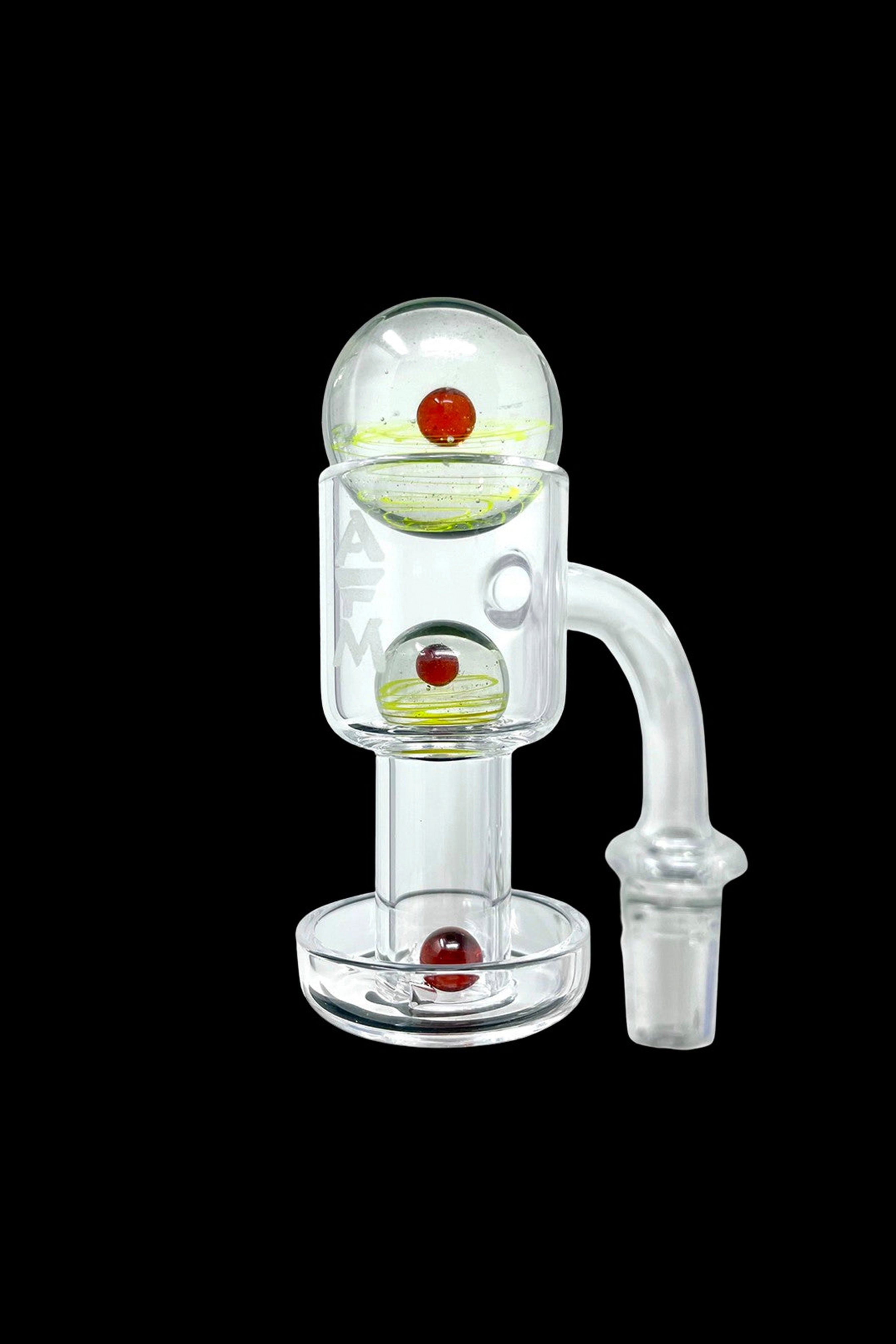 Clear glass bubbler with red and yellow accents, designed for smoking cannabis.