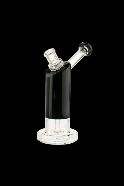 Black and clear glass rig for vaporizing concentrates, isolated on a black background.