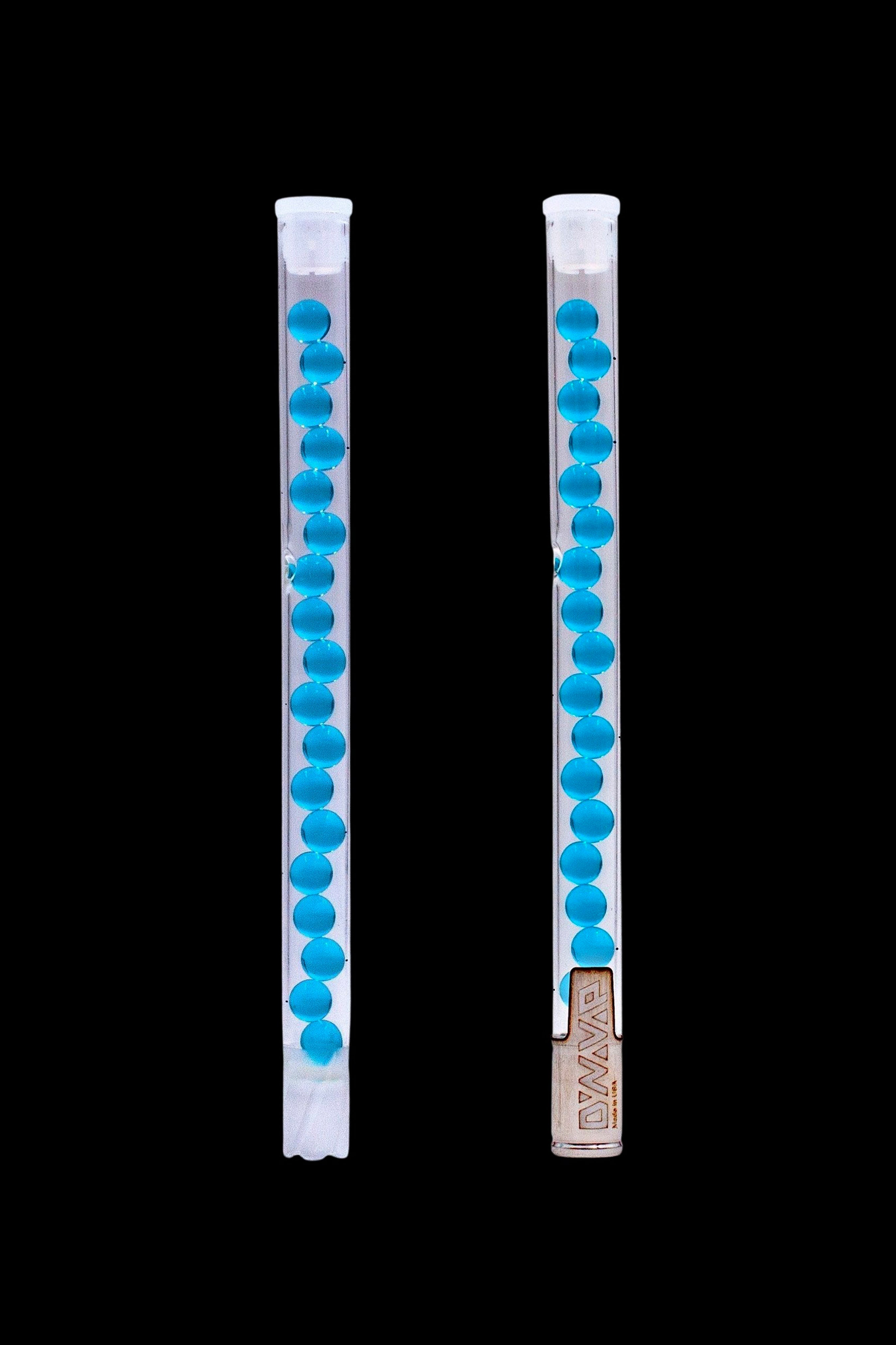Two clear acrylic bubblers with blue beads, used for water filtration in cannabis smoking.
