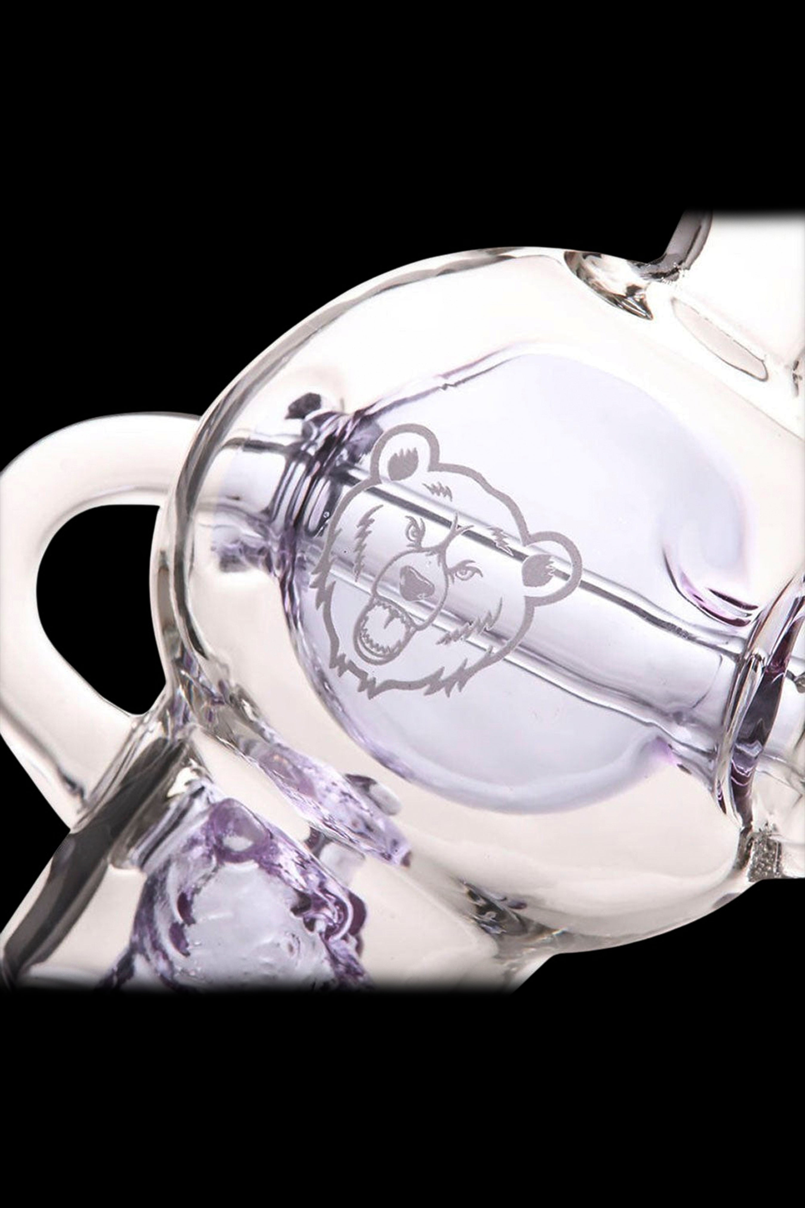 Glass water pipe with a bear graphic and purple swirls.