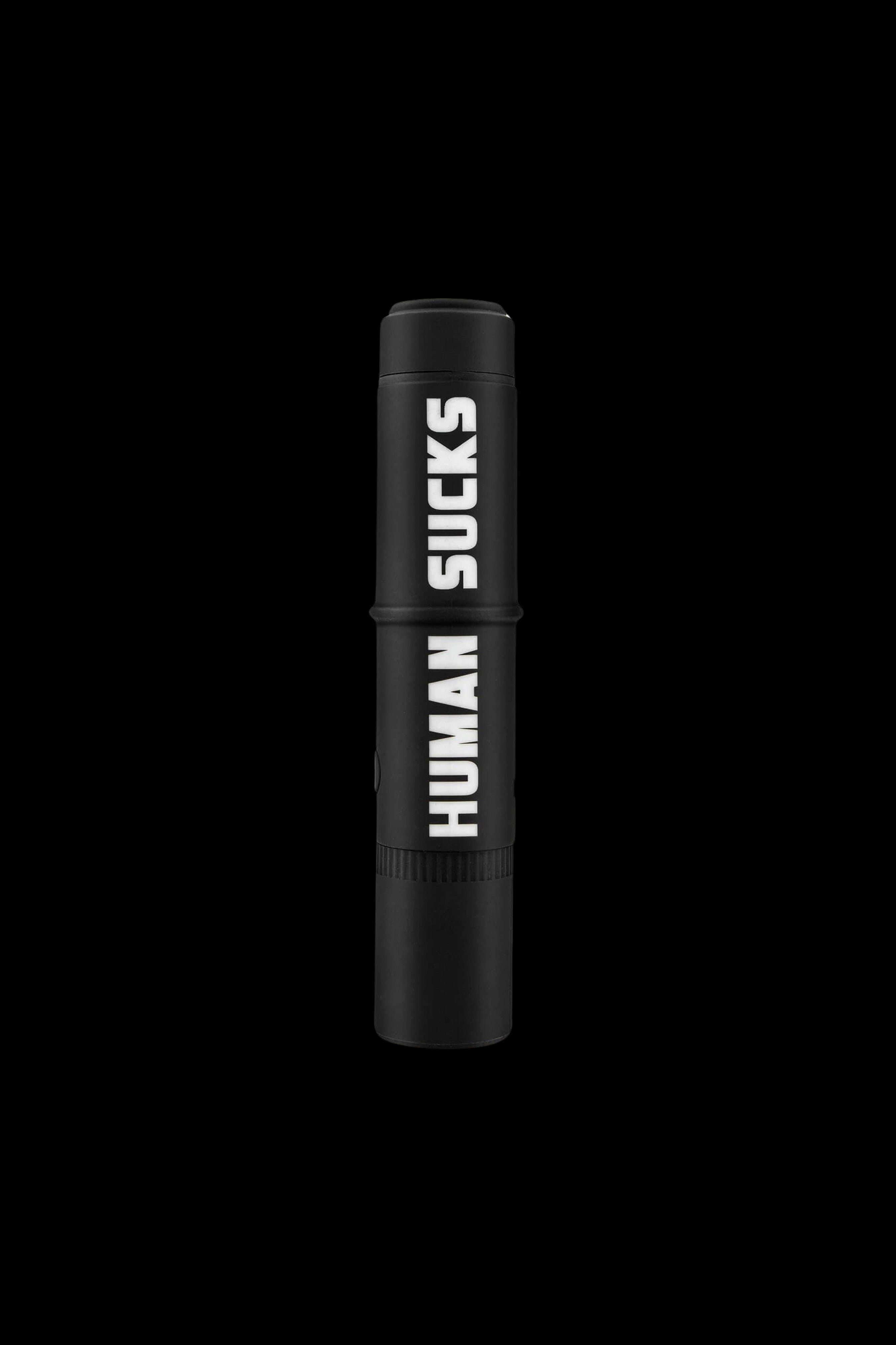 Black cannabis one-hitter with “HUMAN SUCKS” text vertically down the side. <start_of_image>