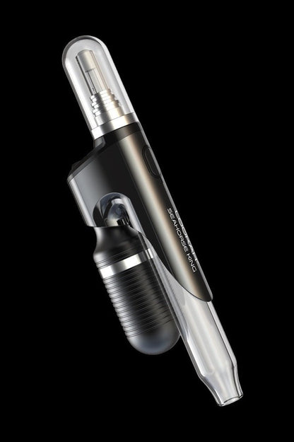Sleek black cannabis oil vape pen with glass mouthpiece and charging base.