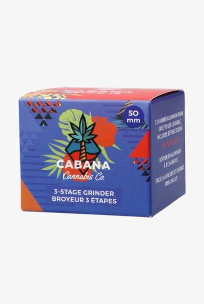 Three-quarter front view of the Cabana Cannabis Co. 3-Stage Grinder Parasol Green box with colorful tropical graphics and a "50 mm" badge.