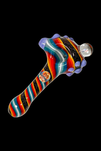 Colorful glass cannabis pipe with striped pattern and detailed glasswork.