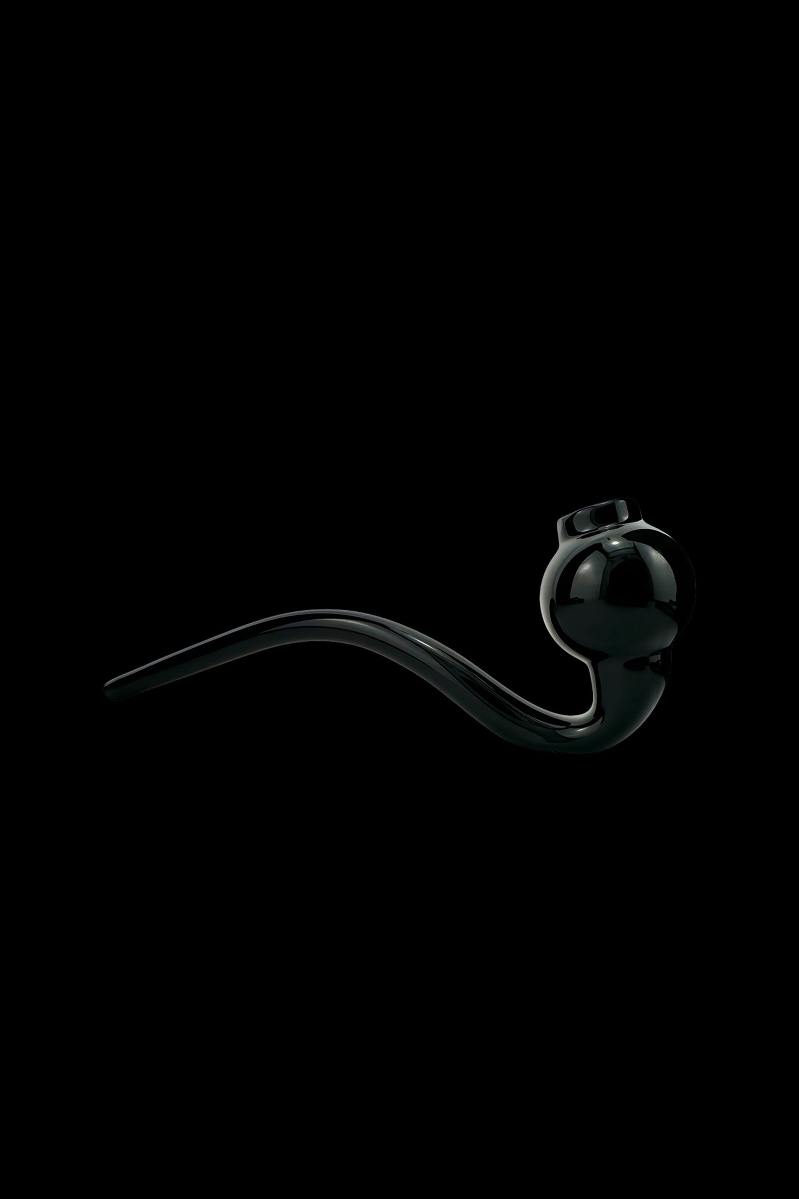 Sleek black glass oil rig against a dark background.