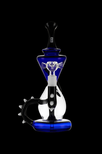 Blue and black glass water pipe (rig) with intricate design and curved mouthpiece, isolated on a black background.