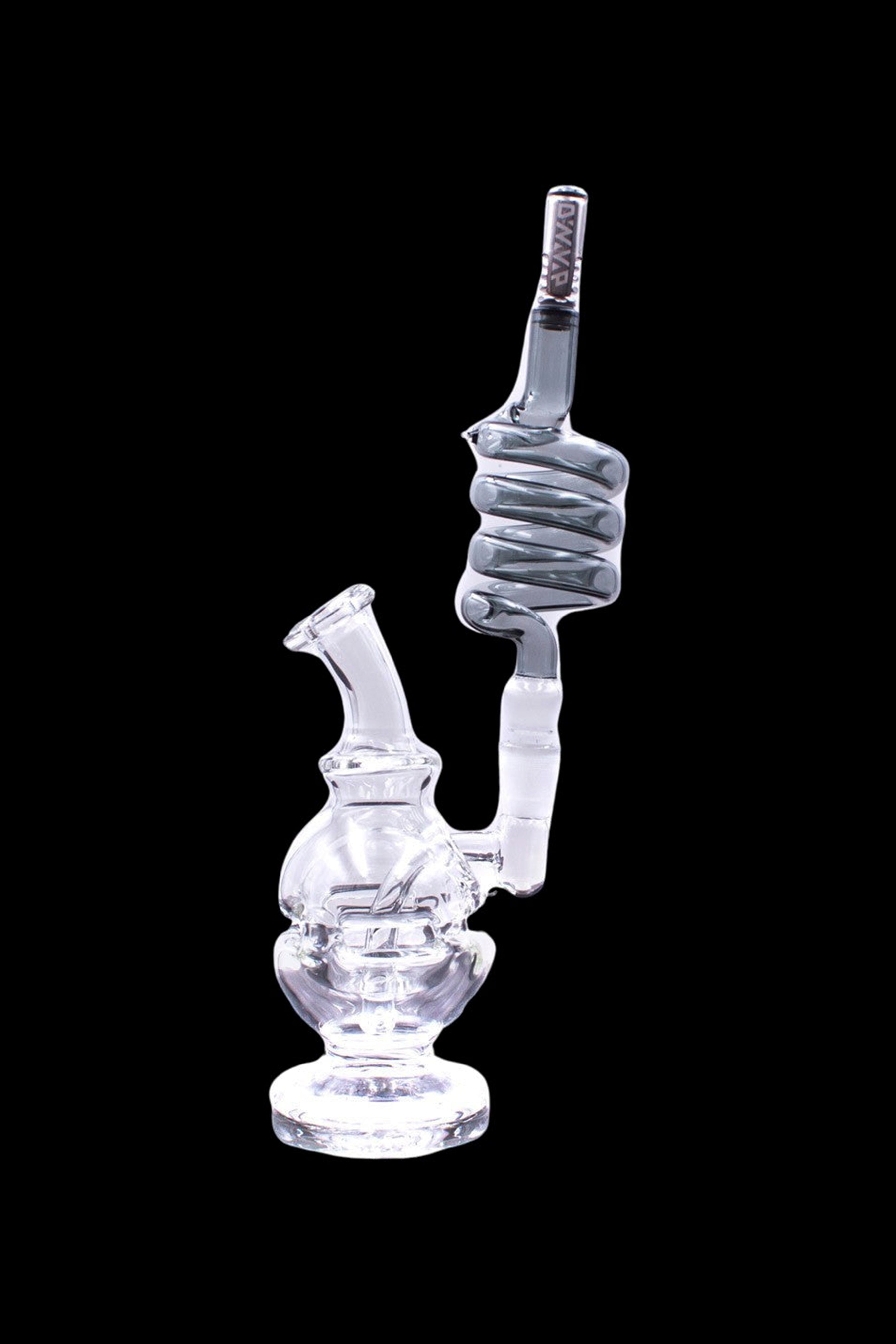 Clear glass water pipe (rig) with intricate bubbler design, isolated on a black background.