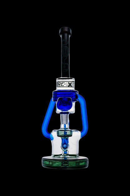 Blue and clear glass dab rig with intricate design against a black background.