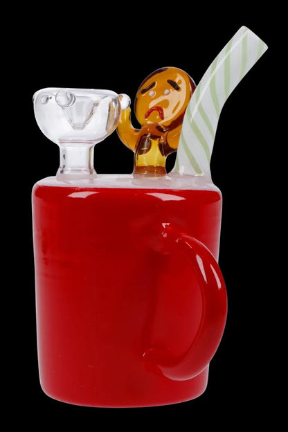Red glass bubbler shaped like a juice box with a cartoon character and straw.