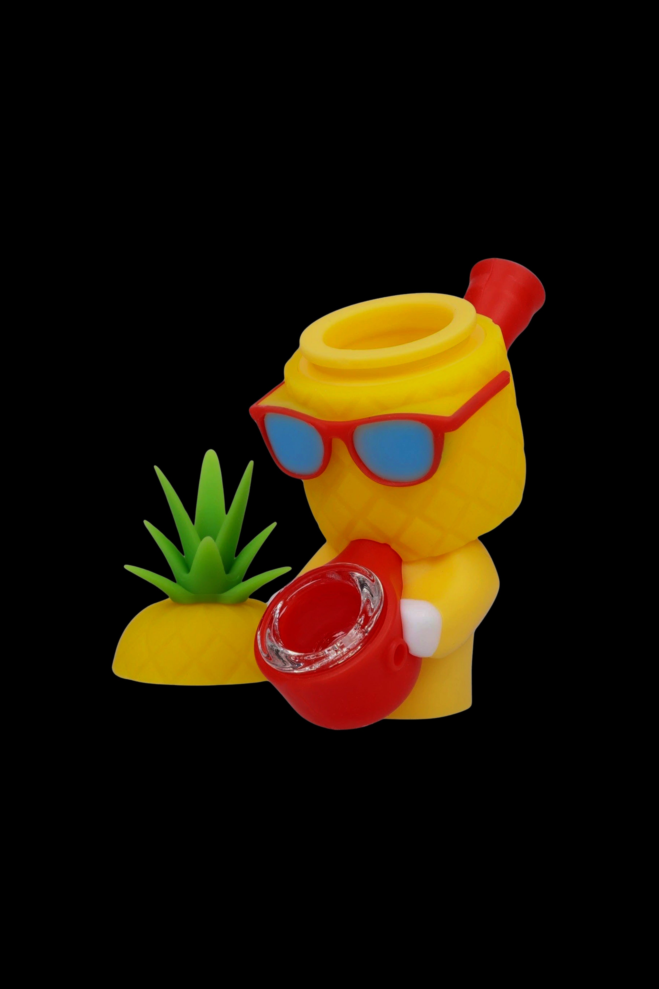 Yellow silicone water pipe shaped like a cartoon character wearing sunglasses, with a small plastic plant base.