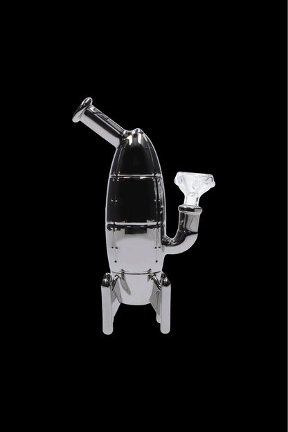 Glass rocket ship-shaped water pipe against a black background.