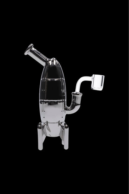 Clear glass dab rig with angled mouthpiece and quartz banger, isolated on black.