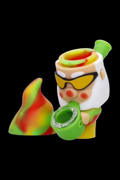 Colorful silicone dab rig with open container and metal bowl insert.