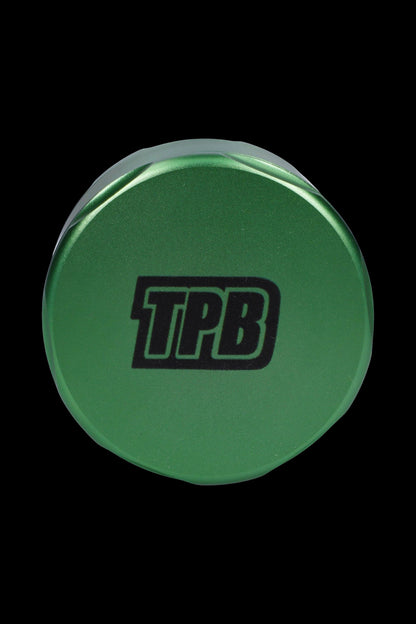 Green cannabis grinder with "TPB" logo.