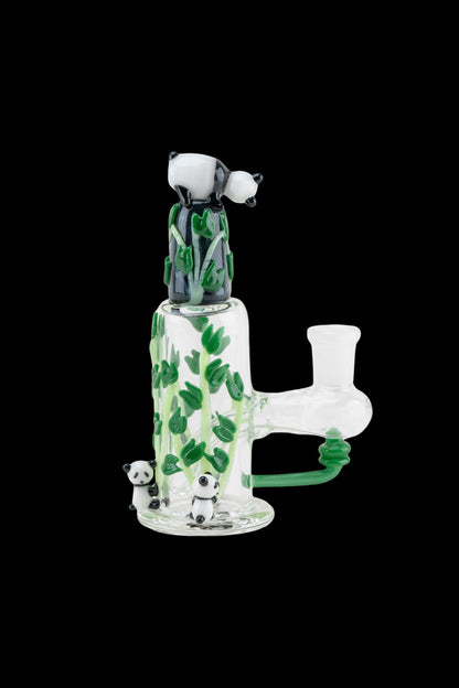 A glass water pipe (bong) decorated with panda and bamboo motifs, isolated on a black background.