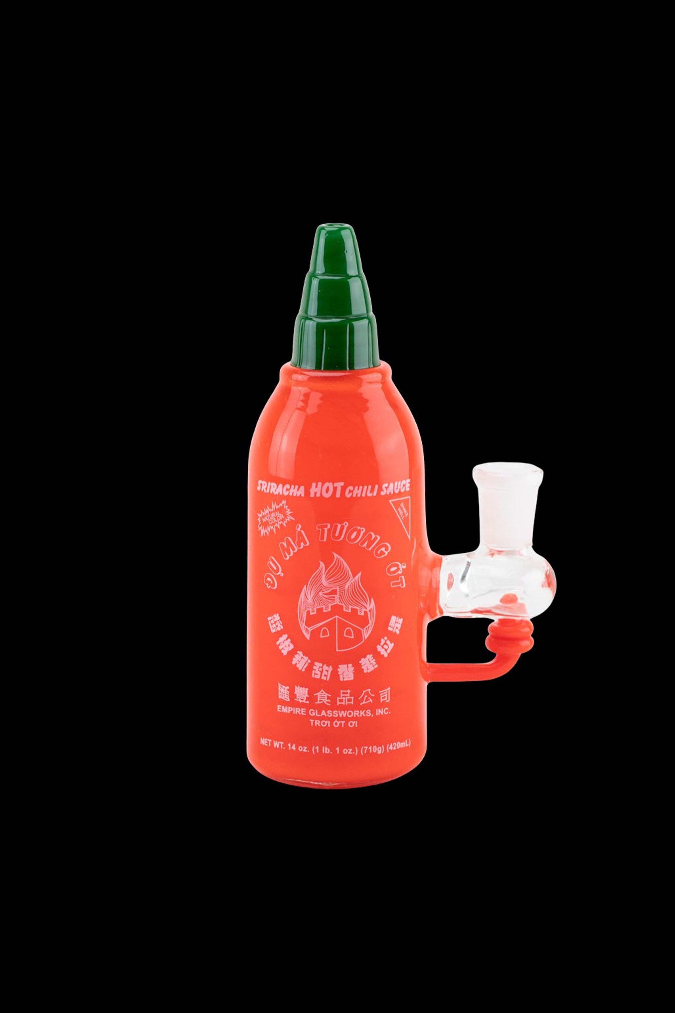 Sriracha-shaped water pipe with a green cap and label details.