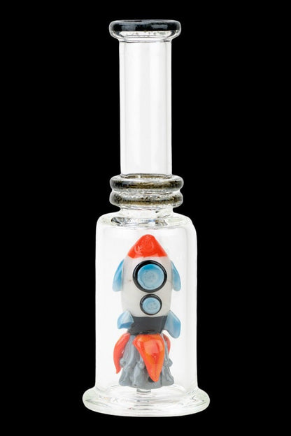 Glass bubbler with a rocket ship design inside.