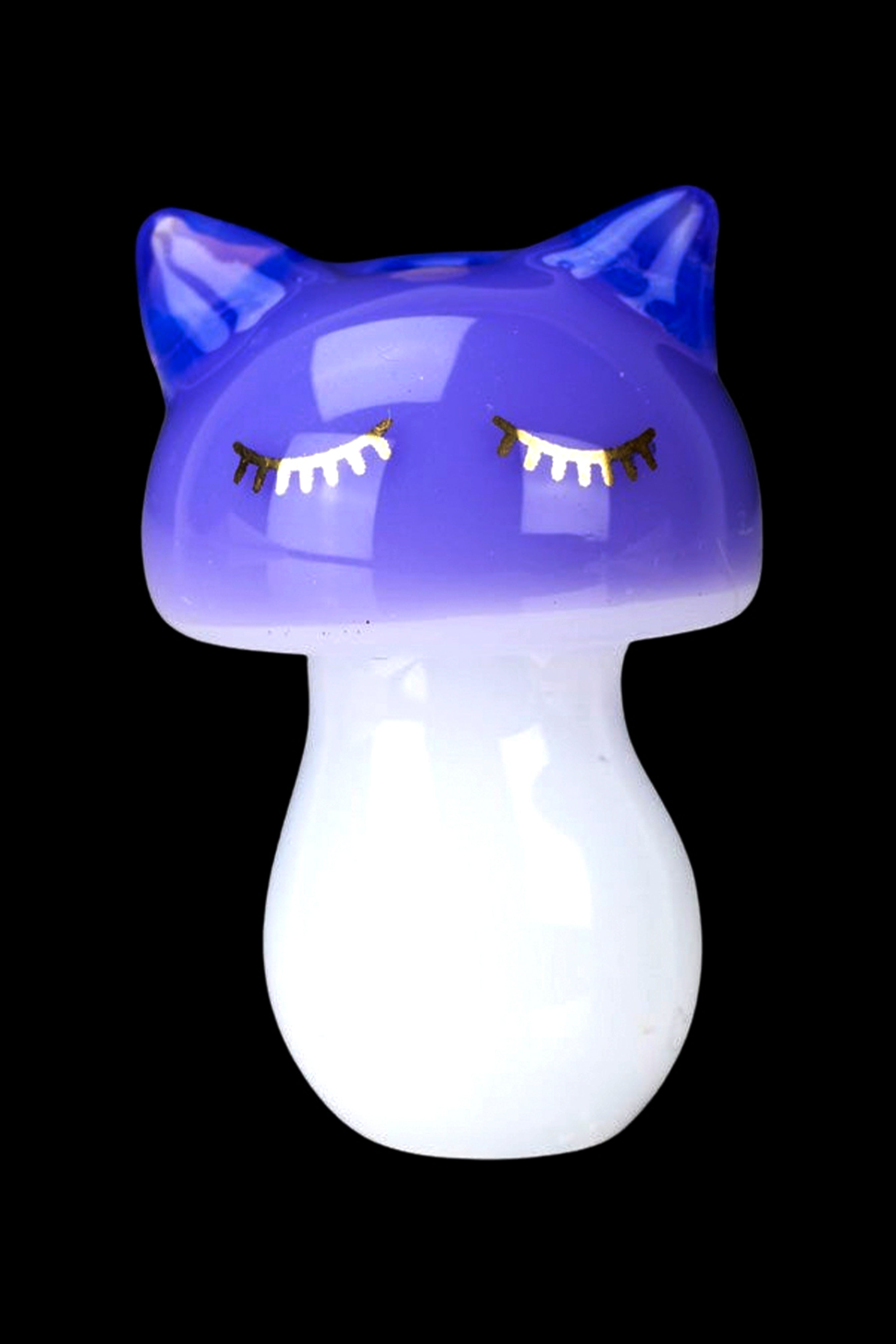 Purple and white glass mushroom-shaped water pipe with decorative eyelashes.