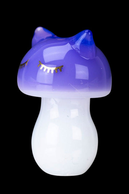 Purple glass mushroom-shaped smoking piece.