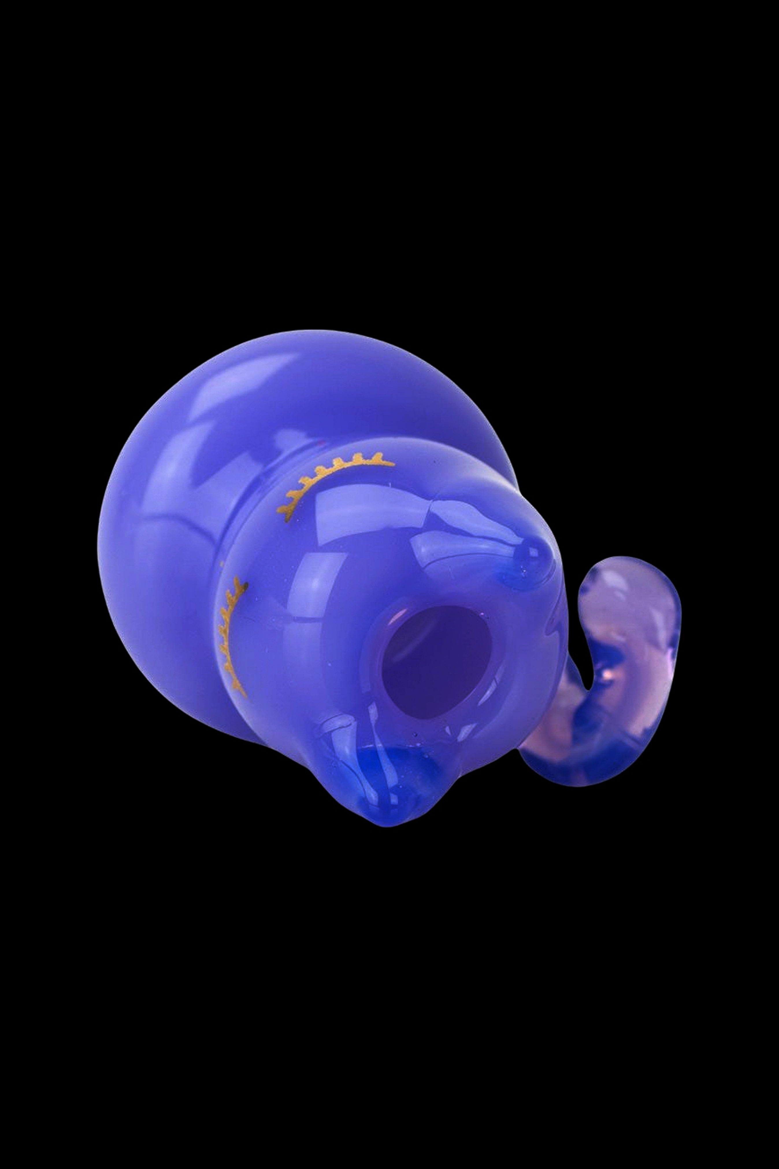Blue glass elephant-shaped water pipe with intricate details, isolated on a black background.