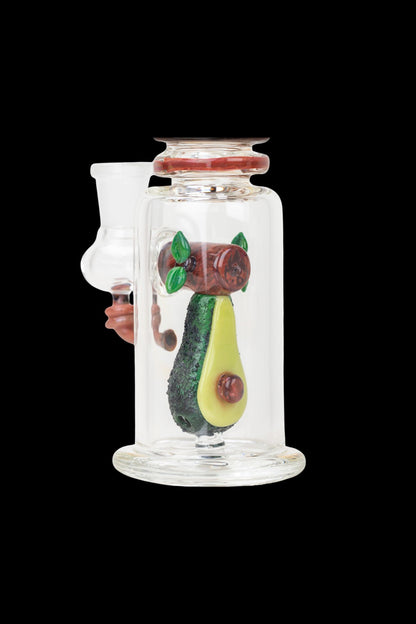 Glass water pipe with avocado and cherry-themed glasswork inside.