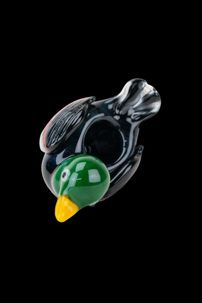 Glass pipe shaped like a duck's head, featuring green and black coloring.