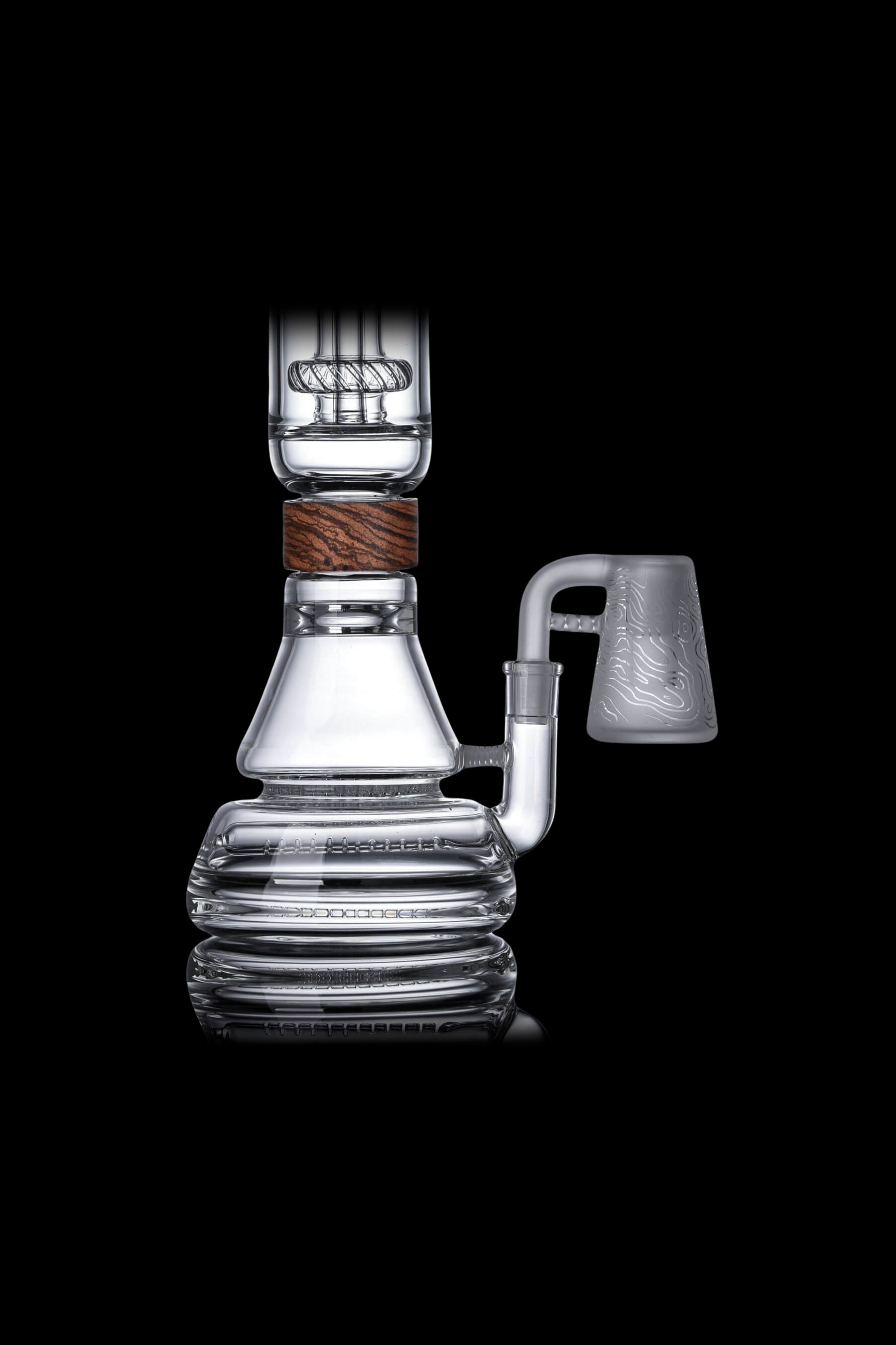 Elegant glass dab rig with intricate detailing and wood accents, studio shot on a black reflective surface.