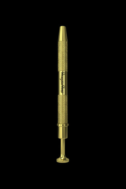 Gold cannabis dab tool on a black background.