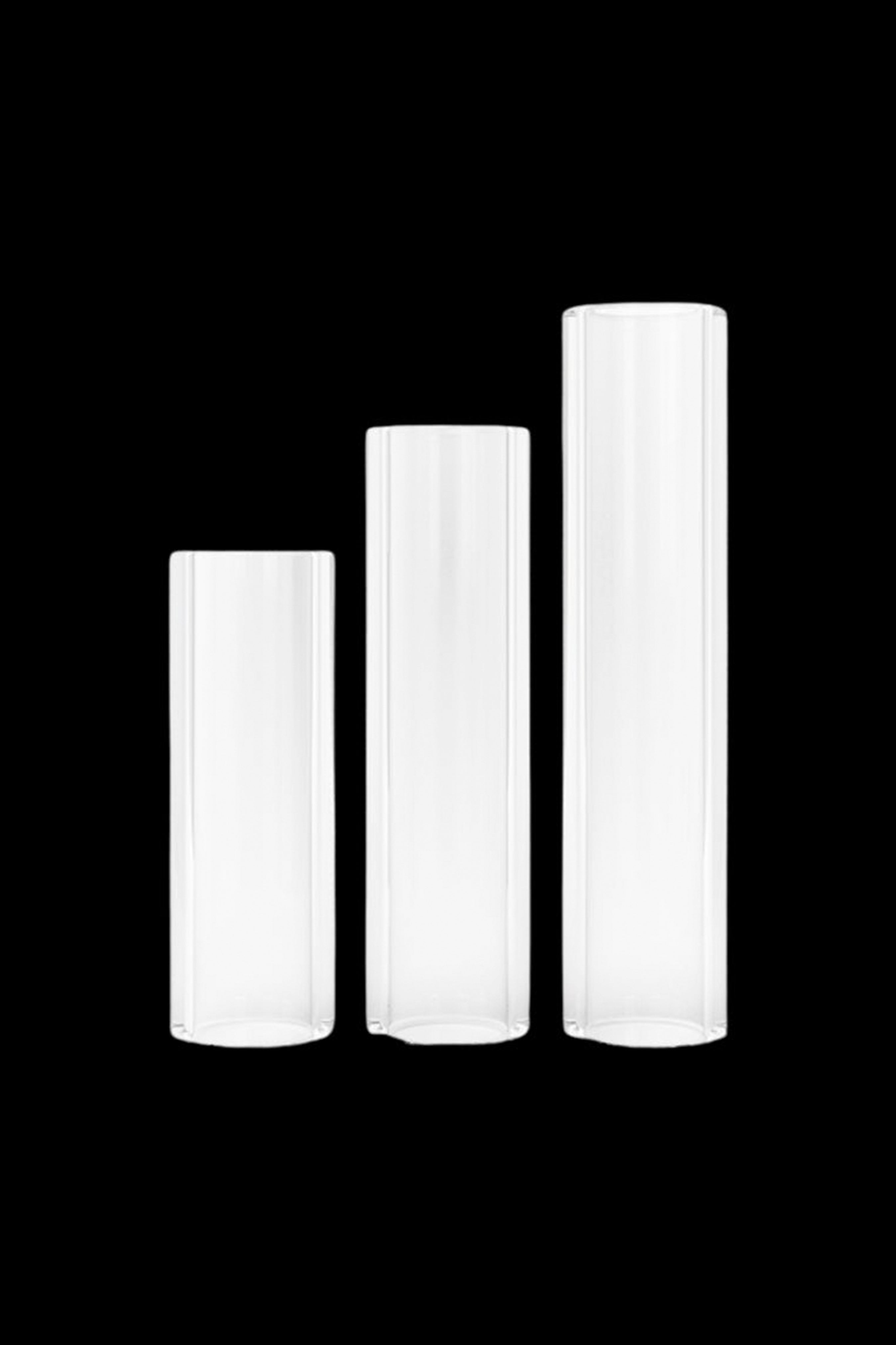 Three white cannabis pre-roll tubes of varying heights.