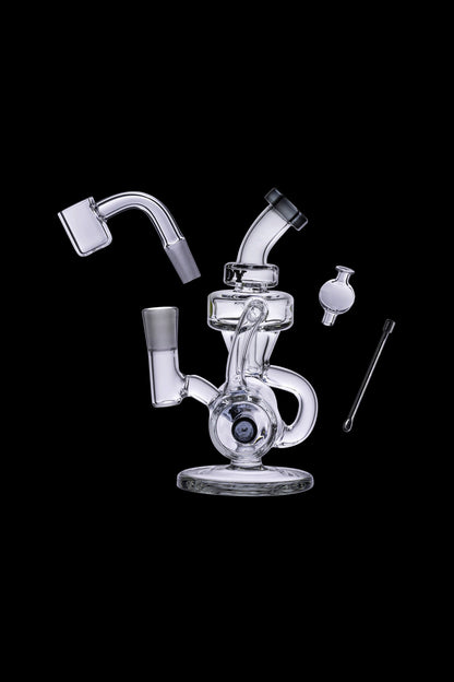 Clear glass dab rig with separate components including a banger, carb cap, and tool, isolated on a black background.