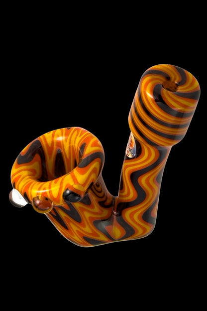 Hand-blown glass pipe with vibrant orange and black swirling pattern.