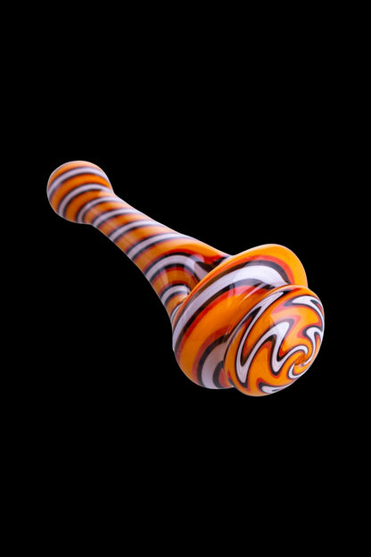Hand-blown glass cannabis pipe with orange and white swirl pattern.