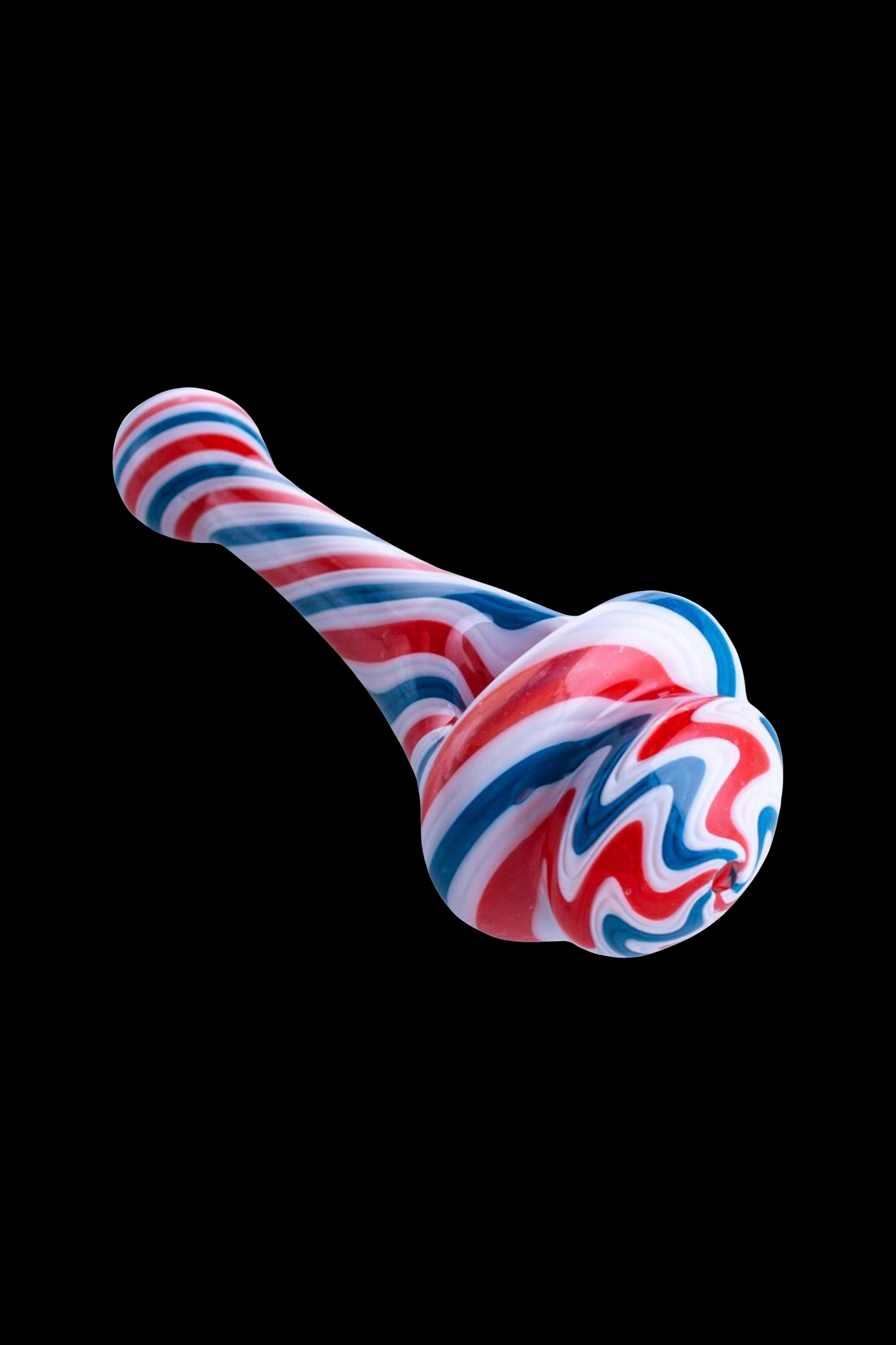 Colorful glass pipe isolated on a black background.