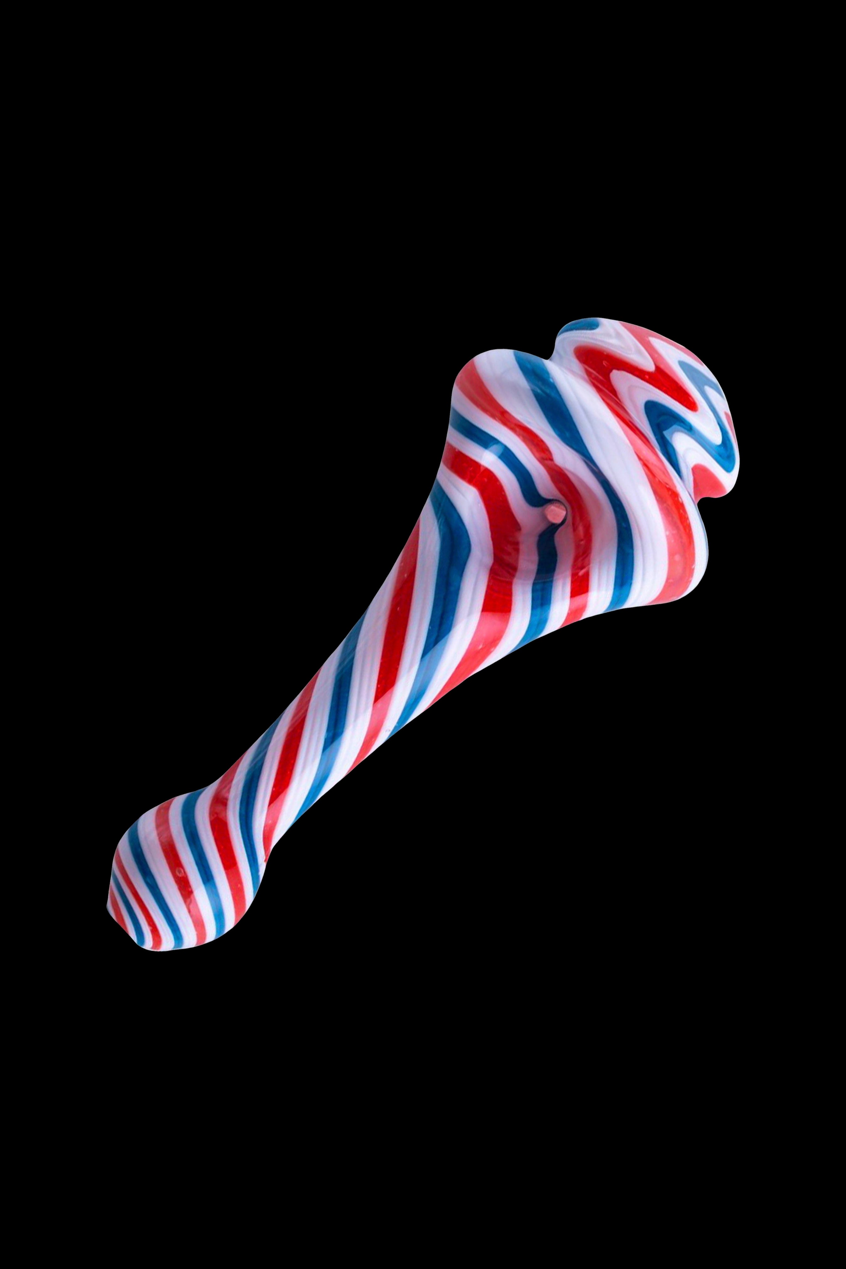 Red, white, and blue swirled glass pipe on a black background.
