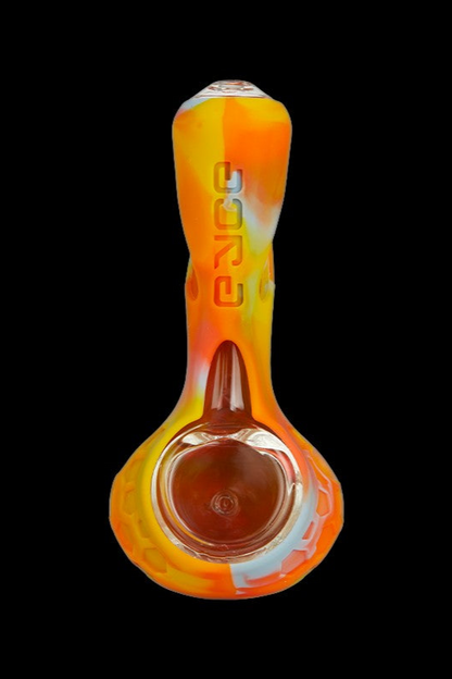 Orange and yellow glass pipe with “sour” text vertically along the neck.
