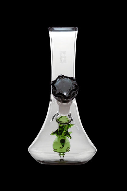 Clear glass bubbler water pipe with green sculpted accents and a black mouthpiece.