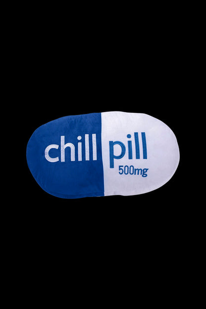 Blue and white capsule labeled “chill pill” with “500mg” text, isolated on a black background.