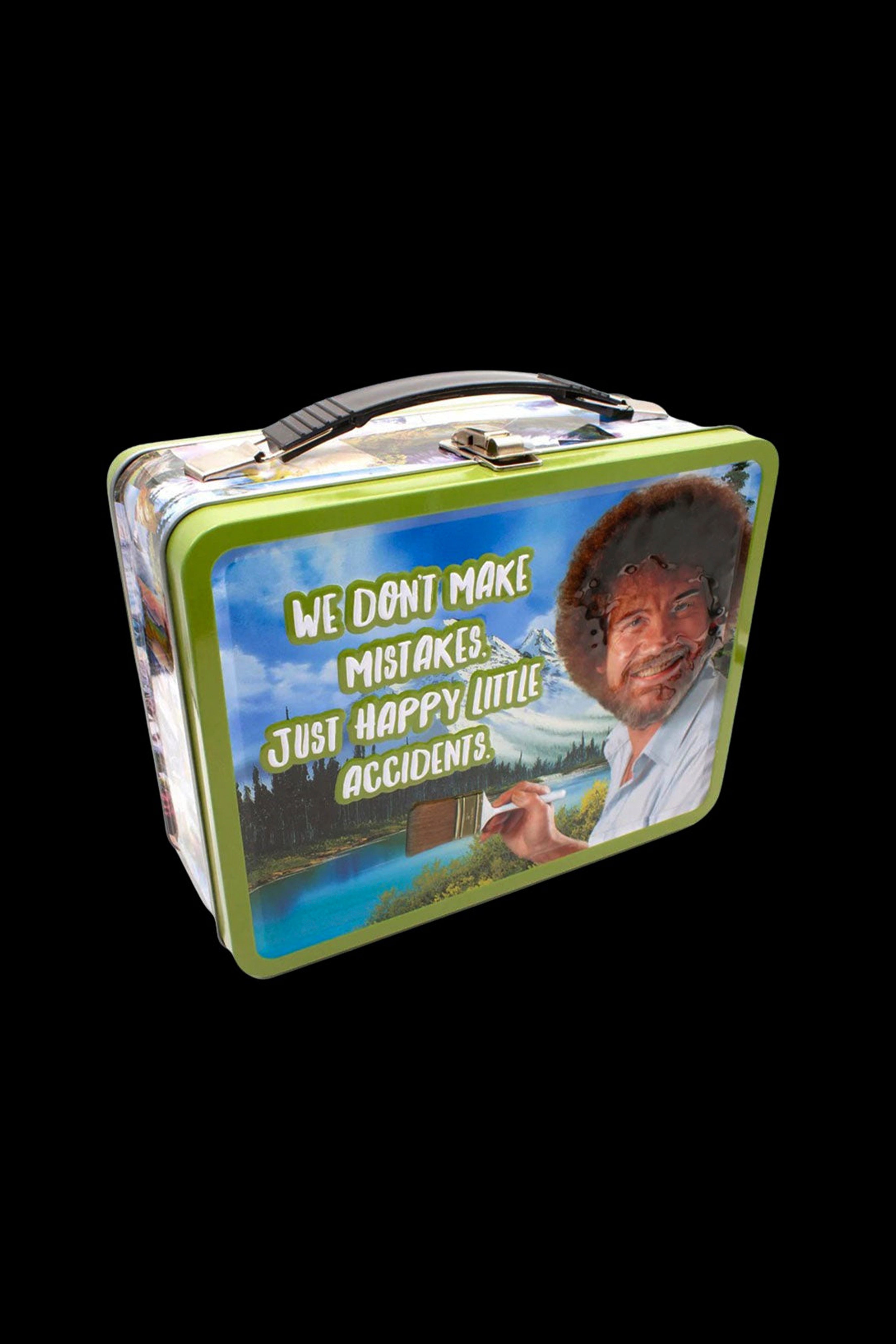 A vintage-style tin lunchbox featuring Bob Ross with the phrase “We don’t make mistakes, just happy little accidents.” and cannabis imagery.
