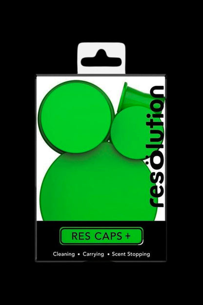 Packaged green silicone caps for cleaning, carrying, and odor control of cannabis concentrates.