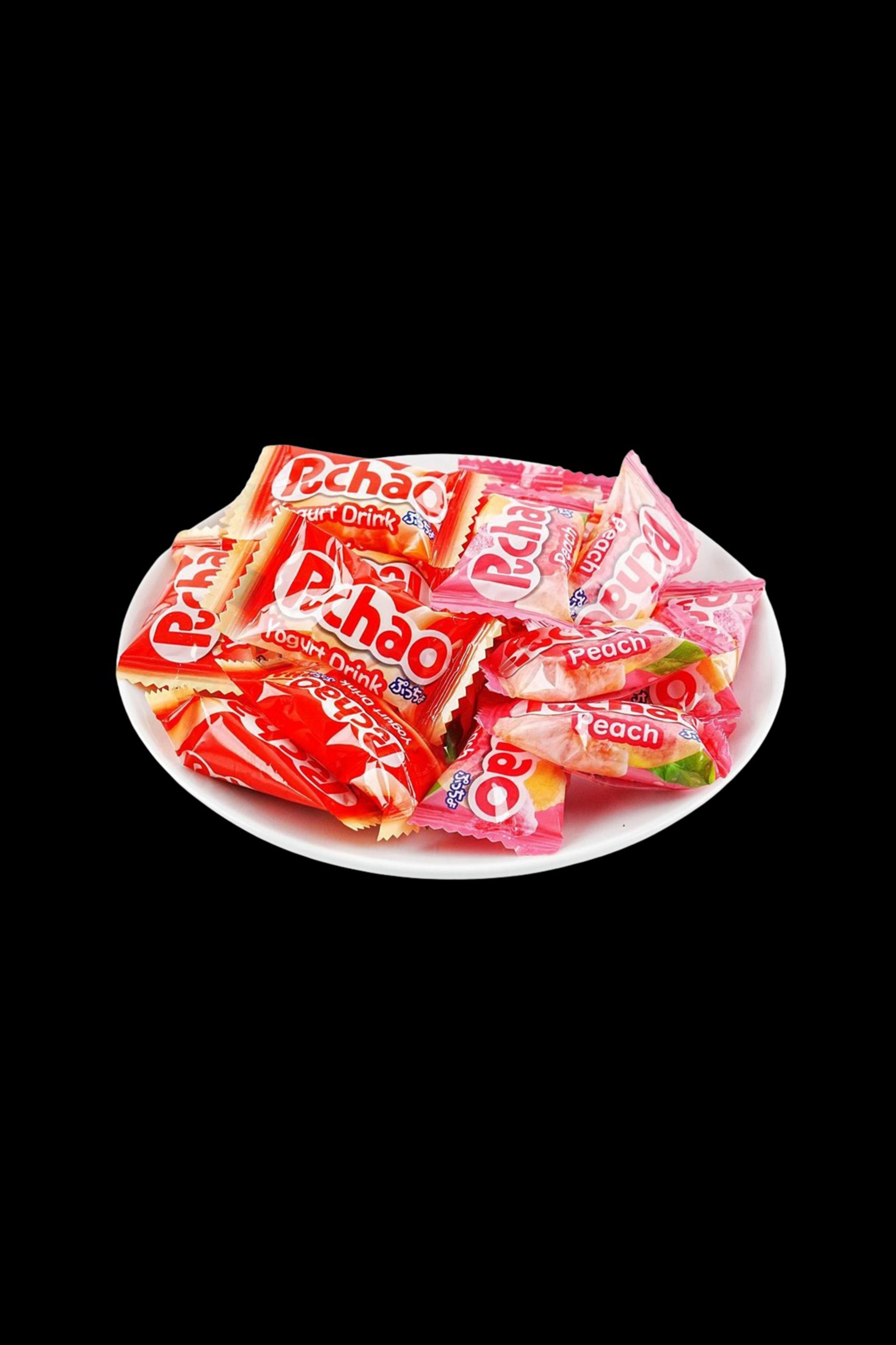 Opened pack of peach-flavored PchaO cannabis drink pouches arranged on a white plate against a black background.