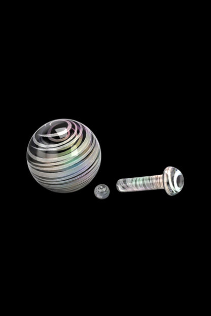 Iridescent glass marbles and screw components for a dab rig or water pipe, isolated on a black background.