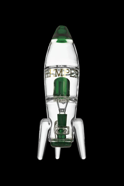 Glass rocket ship-shaped water pipe with green accents, isolated on a black background.