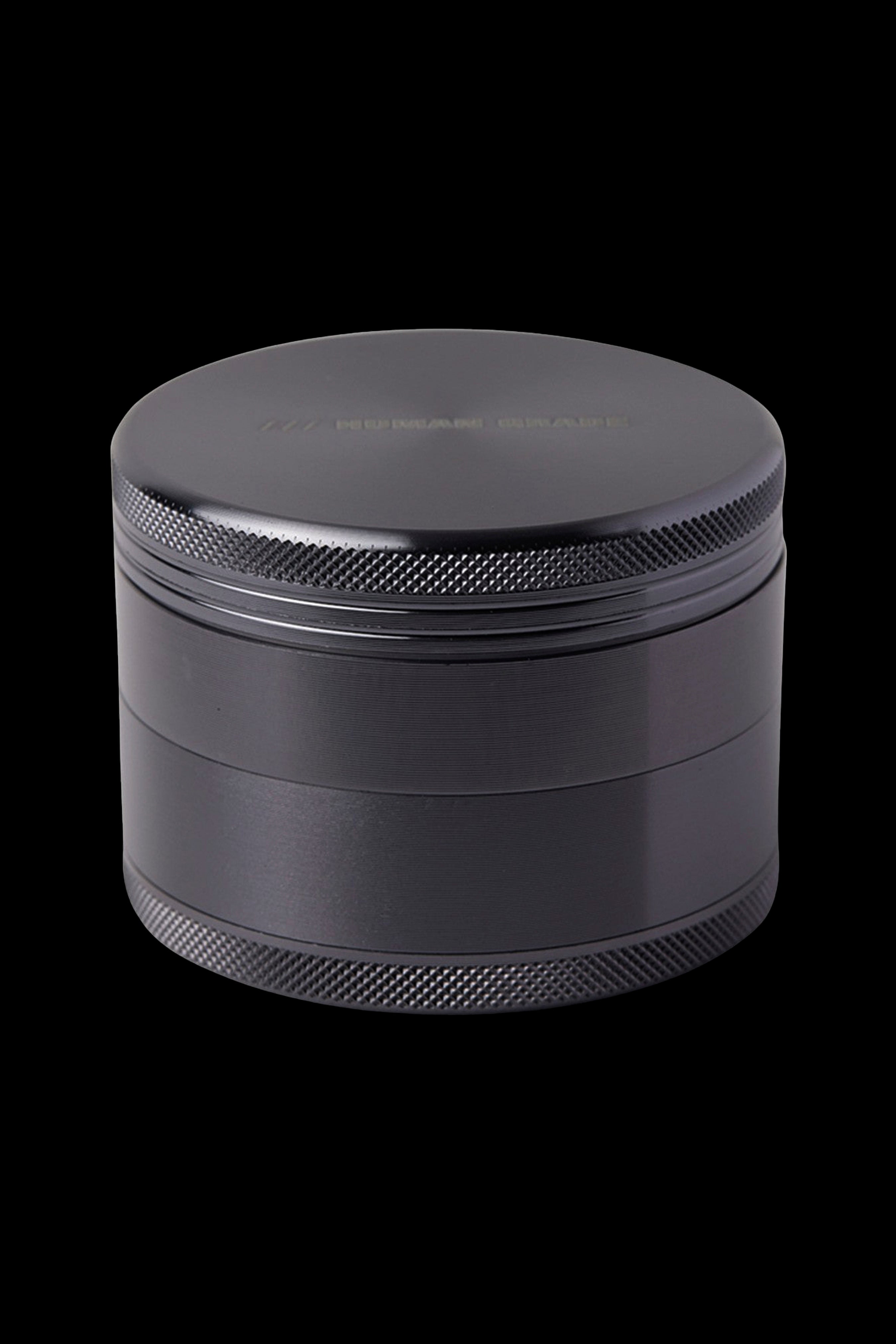 Black four-piece cannabis grinder.