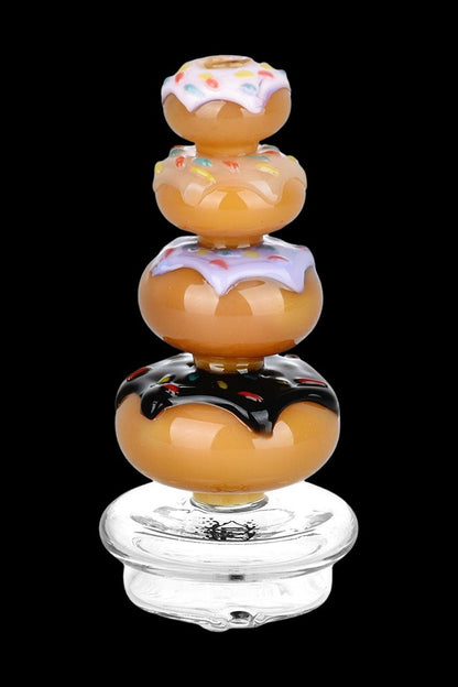 Glass cannabis rig shaped like a stack of glazed donuts.