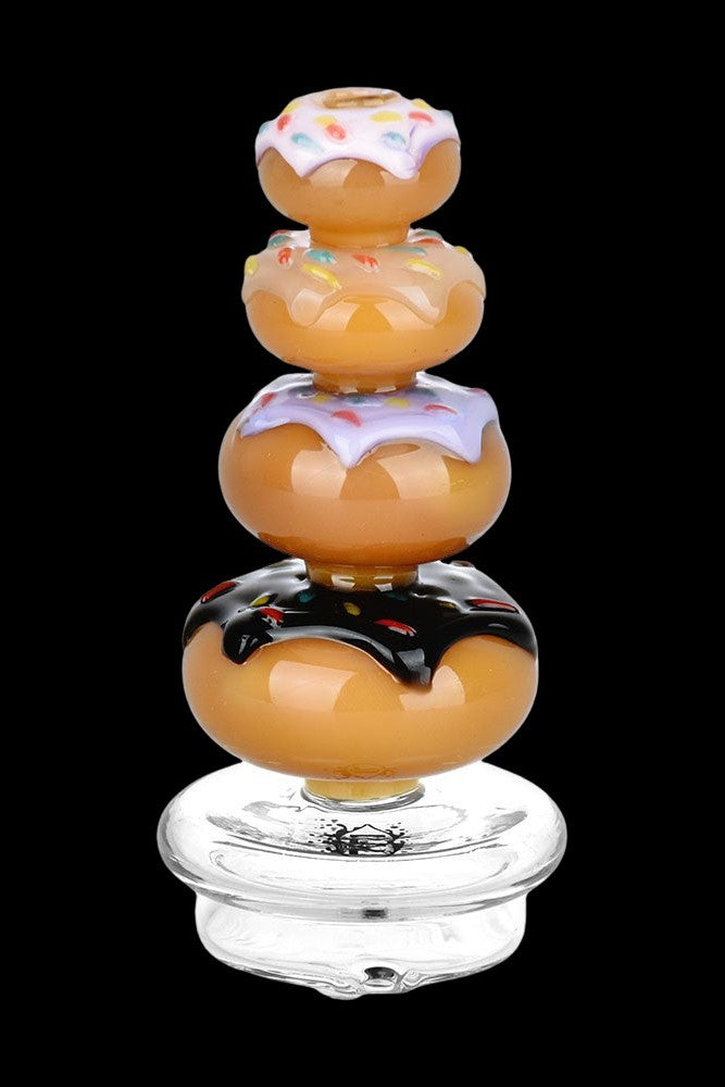 Glass cannabis rig shaped like a stack of glazed donuts.