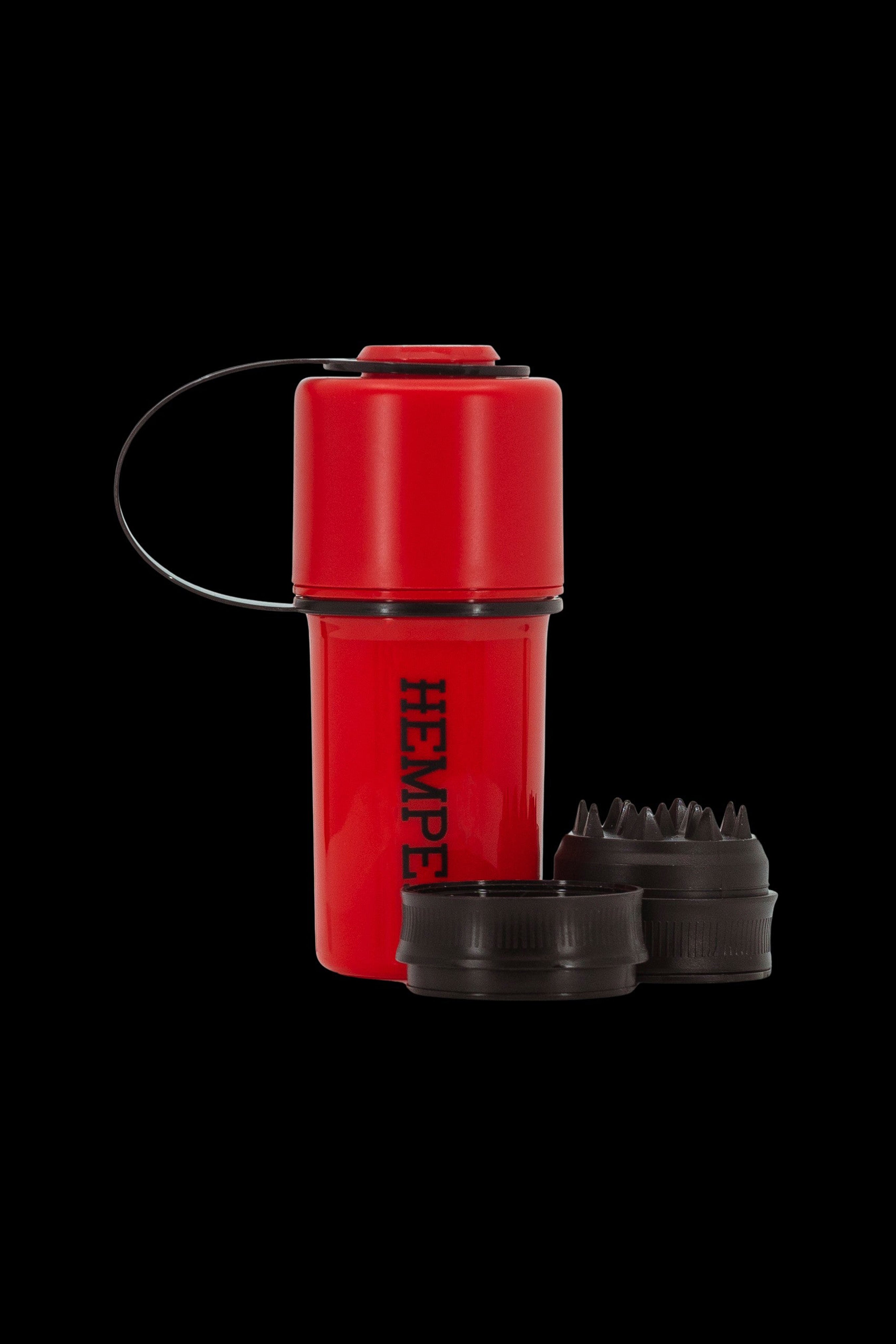 Red, waterproof container labeled "HEMPE" with two disassembled cannabis oil vape cartridges beside it.