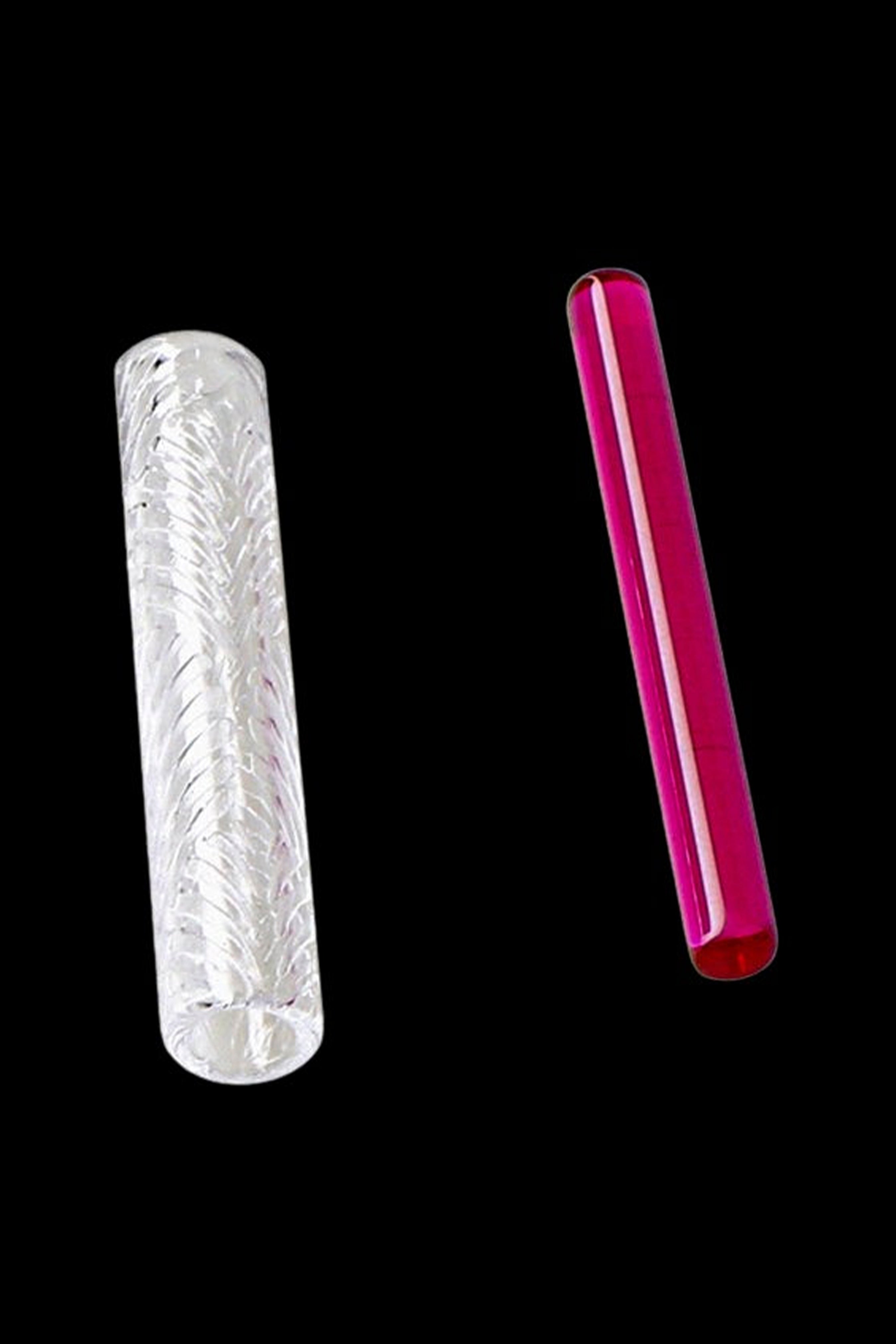 Two glass tubes, one etched silver and the other vibrant pink, displayed against a black background.